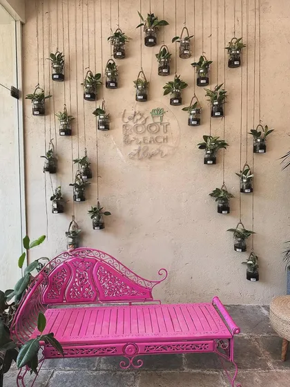 This wall of hanging plants is one of my favorite photo spots. The pink bench adds a pop of color and is the perfect place to sit back and soak in the green vibes.