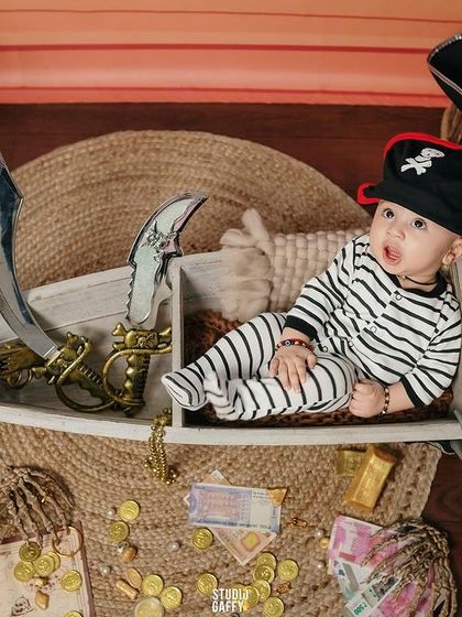 This little pirate is lounging on his ship, ready to find some treasure.