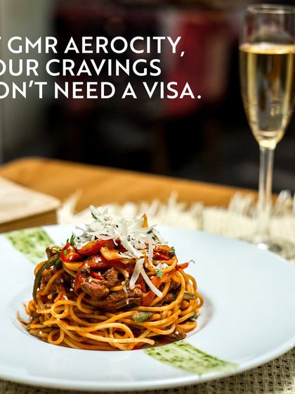 A beautifully plated dish of spaghetti paired with a glass of white wine perfectly illustrates my philosophy. Your cravings for international flavours don't need a visa; they just need a visit to Aerocity.