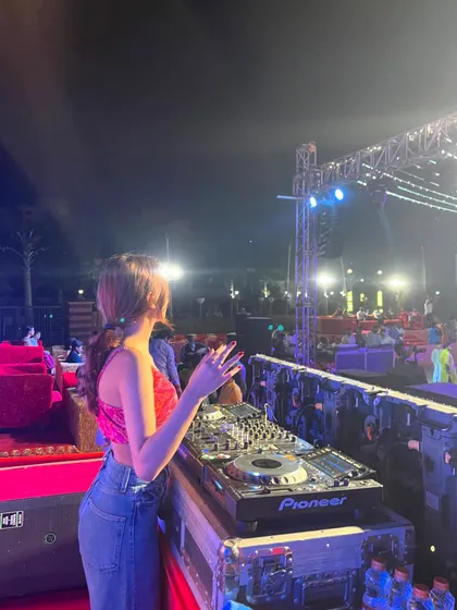 Getting the crowd hyped during the Dandiya celebration. It's all about interacting with the audience and sharing in the festive energy.