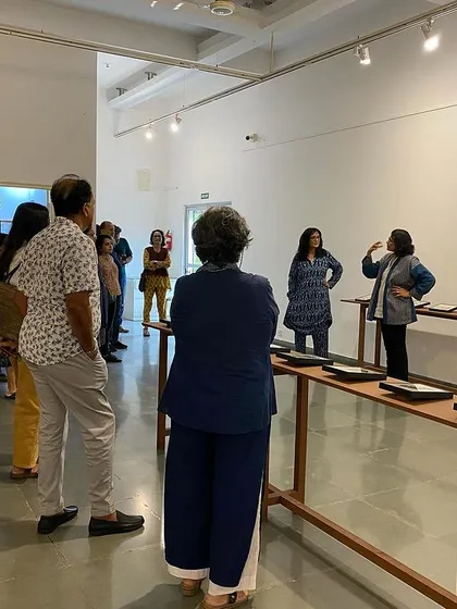 Another view of the walkthrough, showing the engaged group of visitors.