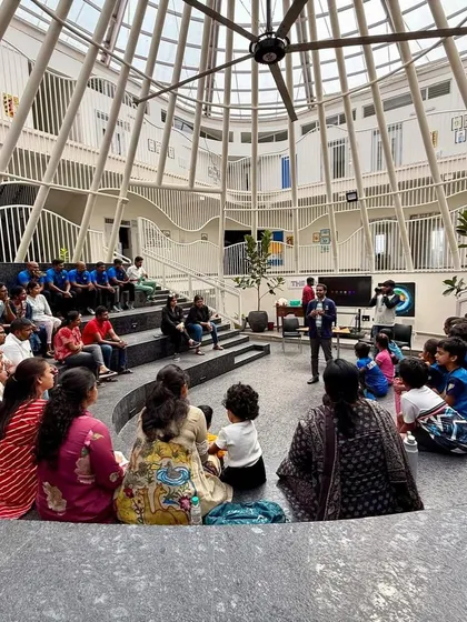 Pullela Gopichand interacting with an audience of parents and children. We believe in educating the entire ecosystem, including parents, on the importance of sports.