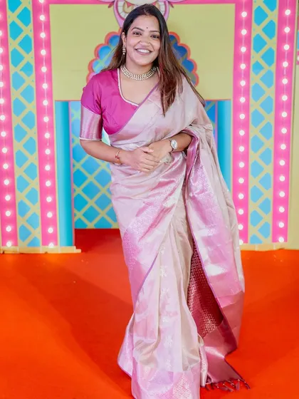 A full-length shot of my pink and beige saree from a festive event, captured by the photographer.