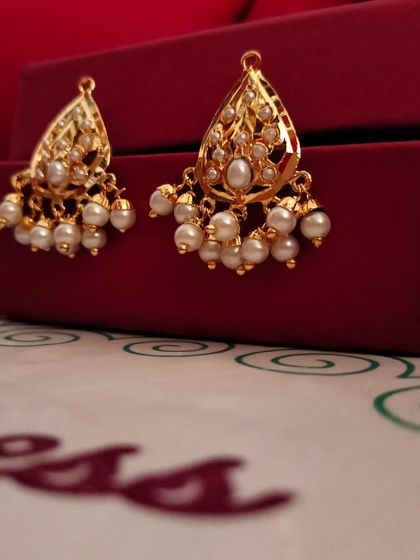 Another shot of the 'कली' (Kali) earrings, showing their simple elegance.