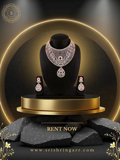 Make a statement without breaking the bank. This American Diamond set with a ruby-red pendant is displayed like a work of art, and you can rent it to feel just as precious.