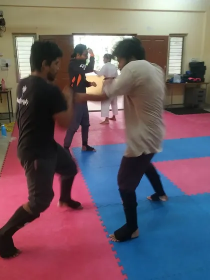 Students sparring on the mats. Constant practice against different partners is the only way to improve.