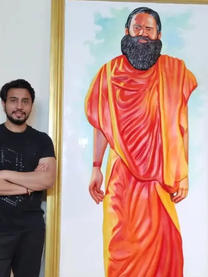 Standing beside my life-sized portrait of Swami Ramdev. It was an honor to paint such a prominent figure in the world of yoga and spirituality.