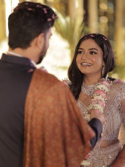 A close-up of the bride's happy expression during her reception, her makeup looking fresh and flawless.