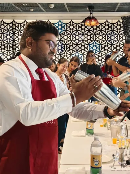 A close-up of a guest learning the proper shaking technique. Our workshops are hands-on, allowing everyone to get a real feel for being a mixologist.