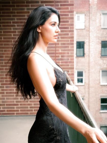A profile shot of Disha Patani in New York. Her long, dark hair was styled to be sleek with natural volume, creating a timeless and elegant look against the city backdrop.