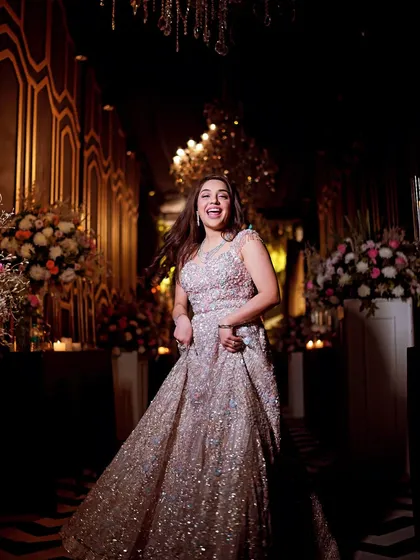 A moment of pure, uninhibited joy. This bride's energetic spin and happy expression perfectly capture the spirit of the celebration.