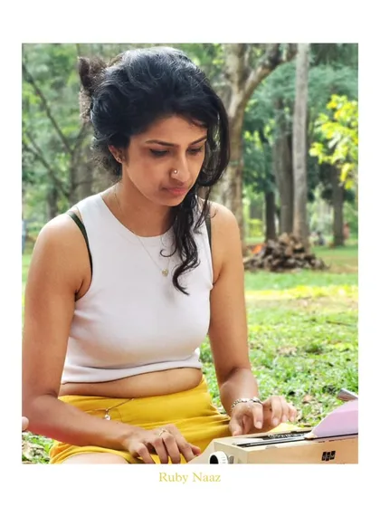 A portrait of me at my typewriter in Cubbon Park. This is where I feel most myself, a living gem in a city of millions, trying to spread a little light with my words.