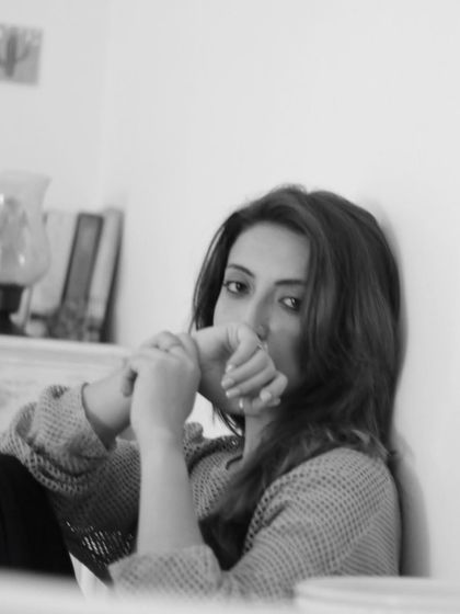 A pensive black and white portrait. I love how monochrome photos can capture a different kind of mood.