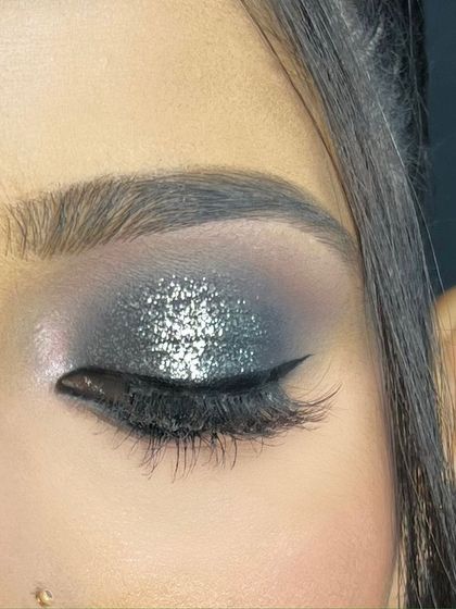 A close-up of a silver glitter smokey eye. This is perfect for a glamorous reception or cocktail party.