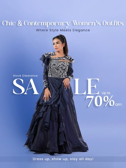 A deep blue gown featuring intricate silver embroidery on the bodice and a layered, ruffled skirt. The design combines classic elegance with modern details, making it perfect for a formal reception or gala.