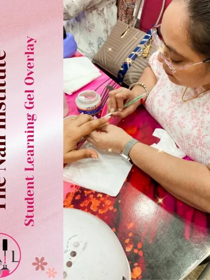 This student is learning how to apply a gel overlay, focusing on creating a smooth, even layer over the natural nail.