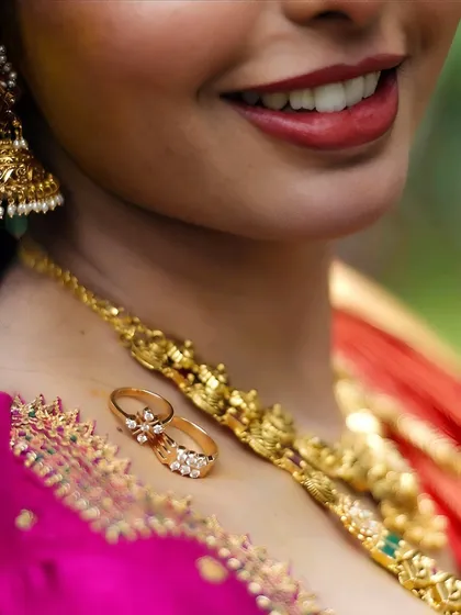 It's the small things that hold the biggest stories. Placing the wedding rings on the bride's collarbone creates a unique and intimate photo, focusing on the symbols of commitment against the backdrop of her bridal glow.