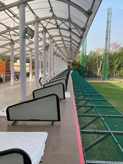 A look at our well-maintained, spacious driving range bays, designed to give you a comfortable and consistent practice environment.