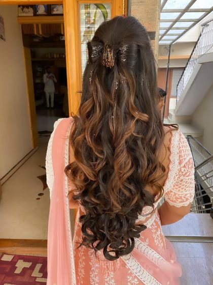 This hairstyle with a claw clip is a great example of modern, effortless chic for a special event.