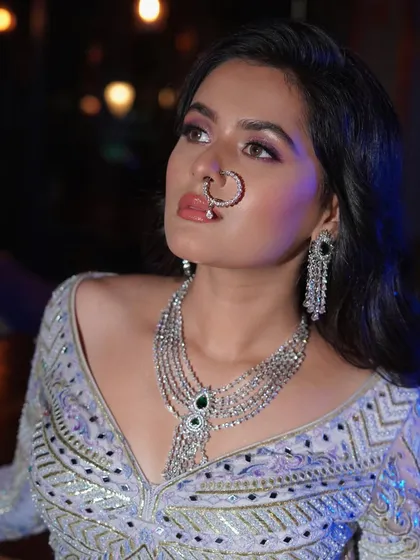Adding a traditional nath to the modern reception look. This shows how I can adapt and style on set to create different moods.