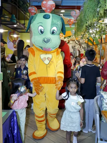 Another angle of the mascot parade, showing how our characters interact directly with the children throughout the facility.