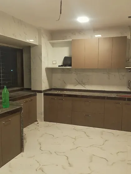 An in-progress shot of a kitchen installation in Navi Mumbai. Here you can see the base cabinets and countertops are in place, with the space ready for final touches and appliance fitting.