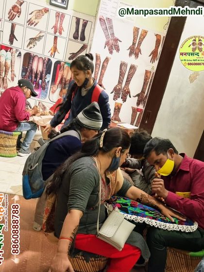 Our artists at work during a busy festival season. We can handle large groups and ensure everyone gets a beautiful design in a timely manner.