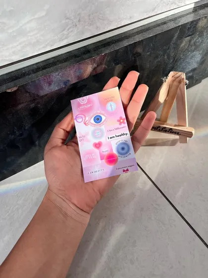 This is a multi-purpose affirmation card I designed. It's filled with positive messages and symbols like the evil eye to bring good vibes and can be carried in a wallet or placed on a desk.