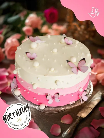 A dreamy butterfly cake with a pink ombre design and delicate edible butterflies. This cake is perfect for a whimsical and elegant celebration.