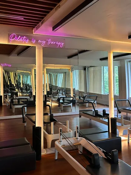 Our studio is lined with mirrors so my trainers and I can keep a close eye on your form. Plus, the "Pilates is my therapy" sign is a constant reminder of why we're here.