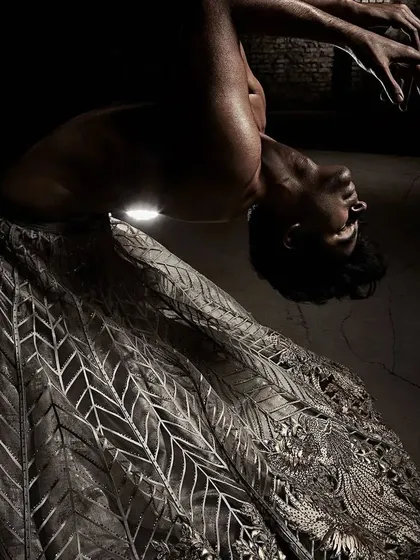 This powerful backbend captures the emotion and physicality I bring to fashion choreography. For this Shantanu & Nikhil shoot, the movement was designed to feel raw and intense, showcasing the intricate garment in a dramatic arc.