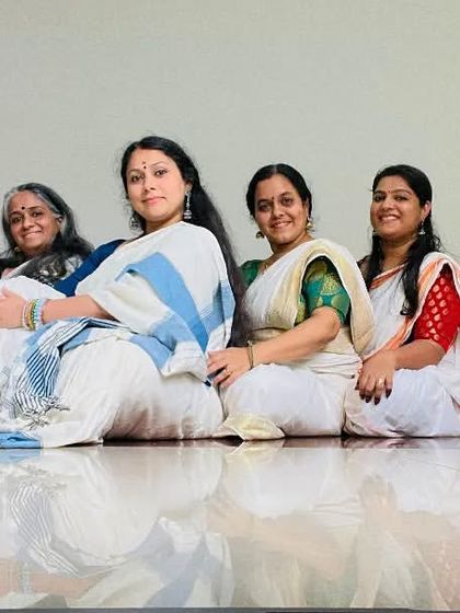 The Samarpana family, seated together after a rehearsal. We are a dance and music ensemble that supports each other's artistic growth.