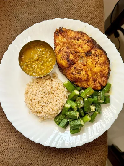 A simple meal of barley, dal, fried fish, and sautéed okra. Barley is a great high-fiber alternative to rice.