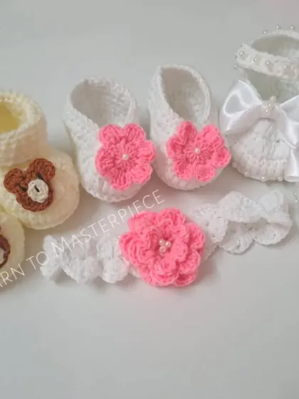 I love creating variety. This image shows three different bootie and headband sets: a bear theme, a pink floral theme, and a white satin bow theme.