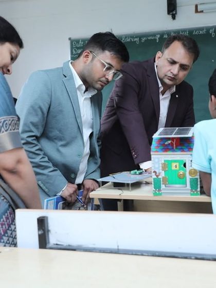 A young student presents his solar-powered project to instructors and guests. We encourage projects that solve real-world problems, like creating sustainable energy solutions.