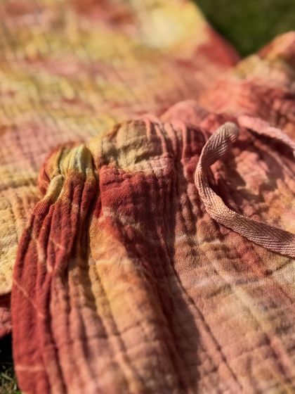 The texture of the organic cotton fabric, rich with the warm colours of Indian herbs. This hand-dyed set is a perfect example of slow, sustainable fashion for children.