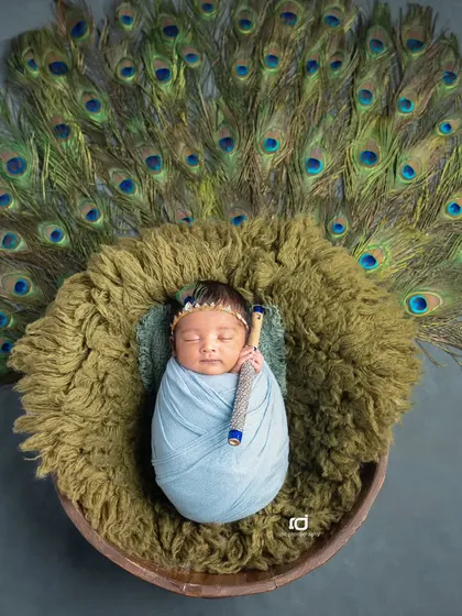 Another version of the Krishna theme, this time with a blue wrap and a beautiful display of peacock feathers.