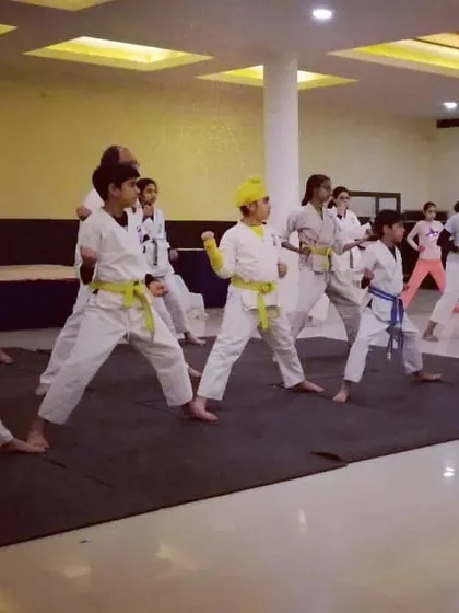 Our kids' class is pumped up and ready to learn. We teach the art of karate with sincerity, ensuring every child builds a strong foundation in a group setting.