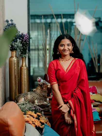 The rich, solid red of the Mysore silk is a timeless choice that exudes confidence and grace.