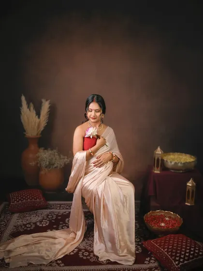 A quiet moment of connection. The mom to be holds a flower to her belly, symbolizing the new life blooming within.