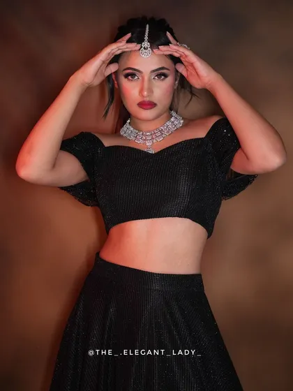 For a chic and bold statement, this all-black shimmer lehenga is your go-to. The off-shoulder blouse and sparkling fabric make it a perfect outfit for evening receptions, cocktail parties, or any event where you want to stand out with modern flair.