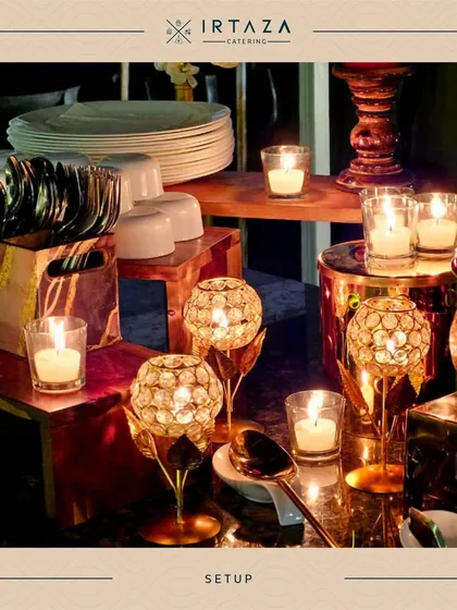 A close-up of the cutlery and serving area. Even the arrangement of plates and candle holders is done with an eye for design, featuring crystal-accented decor to complement the luxurious theme.