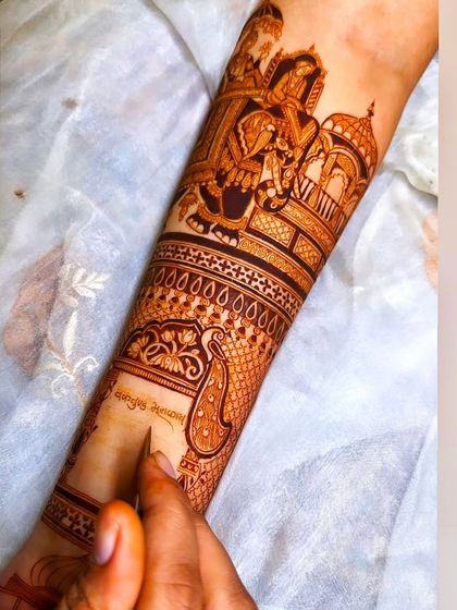 The artistry in progress, showing how I add shading and detail to bring a wedding scene to life on the forearm.