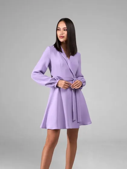 I also create custom dresses, like this elegant lavender blazer dress. It features a wrap design with a self-tie belt and bishop sleeves, offering a sophisticated silhouette that's perfect for formal events.