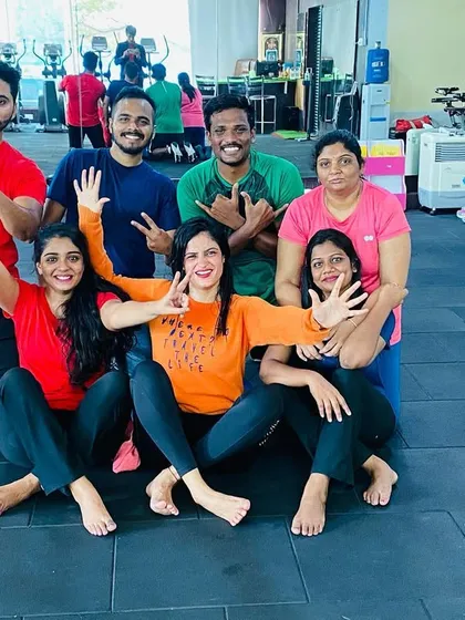 The crew getting playful for the camera after a great workout.