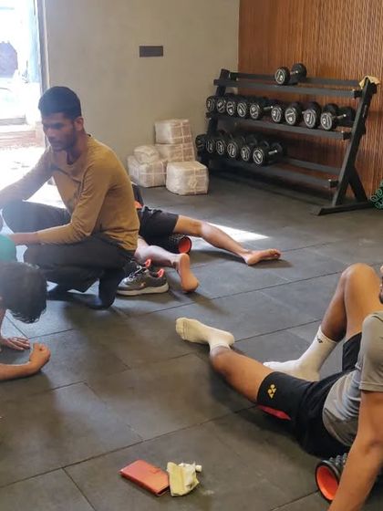Recovery is just as important as training. Here, athletes are using foam rollers for self-myofascial release to ease muscle soreness and improve flexibility after a tough session.