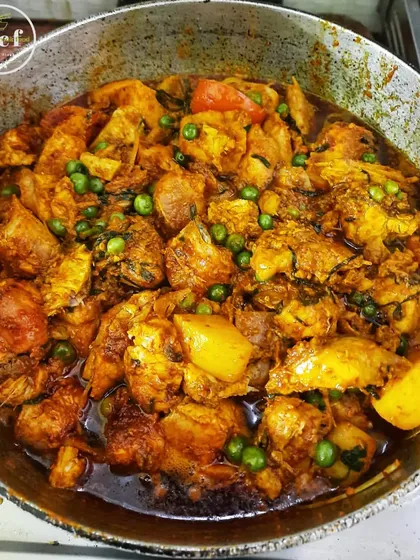 A simple and comforting fish curry with potatoes and green peas.