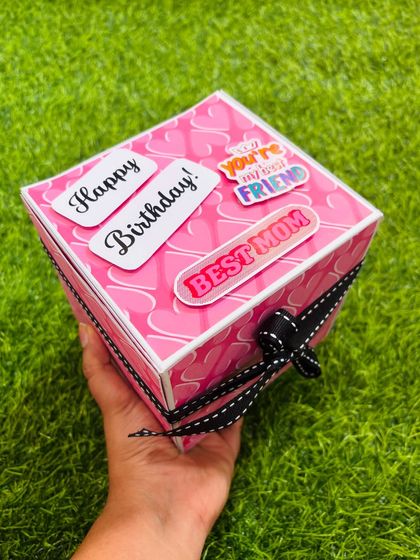 This is my infinite box, designed for a mom's birthday. It's a cube that you can flip endlessly to reveal new photos and messages. This one holds 42 photos and 12 messages.