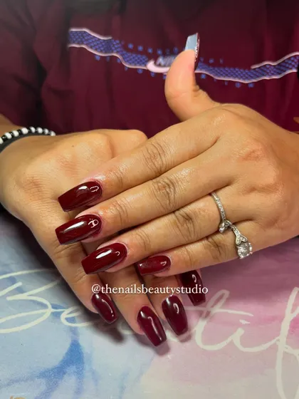 Another shot of these gorgeous red wine nails, showing their glossy finish.