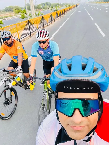A selfie capturing three riders on the expressway. The open road and good company make for a perfect morning.